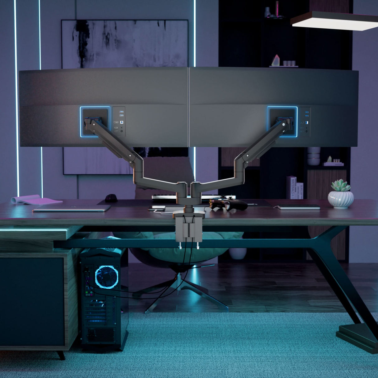 A stylish, dimly lit office features the Mount-It! Heavy-Duty Dual Monitor Mount with Gas Spring Arms holding two large curved screens, complemented by a sleek keyboard and a desktop computer with striking blue lighting.
