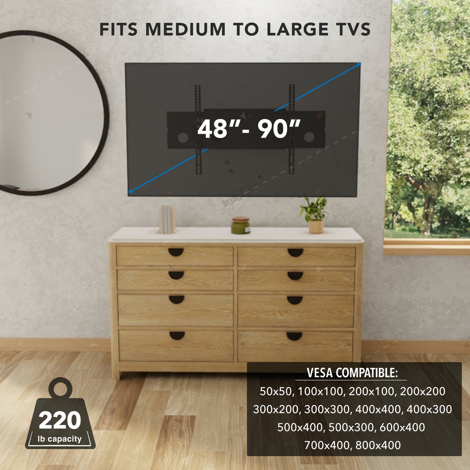 Modern living room setup showing a medium to large TV mounted on the wall using the Heavy Duty Full Motion TV Wall Mount with Extension, capable of supporting TVs sizes 48 to 90 inches with VESA patterns up to 800x400mm and a weight capacity of 220 pounds, demonstrating its robust steel dual arm design that allows secure full motion adjustments for optimal viewing.