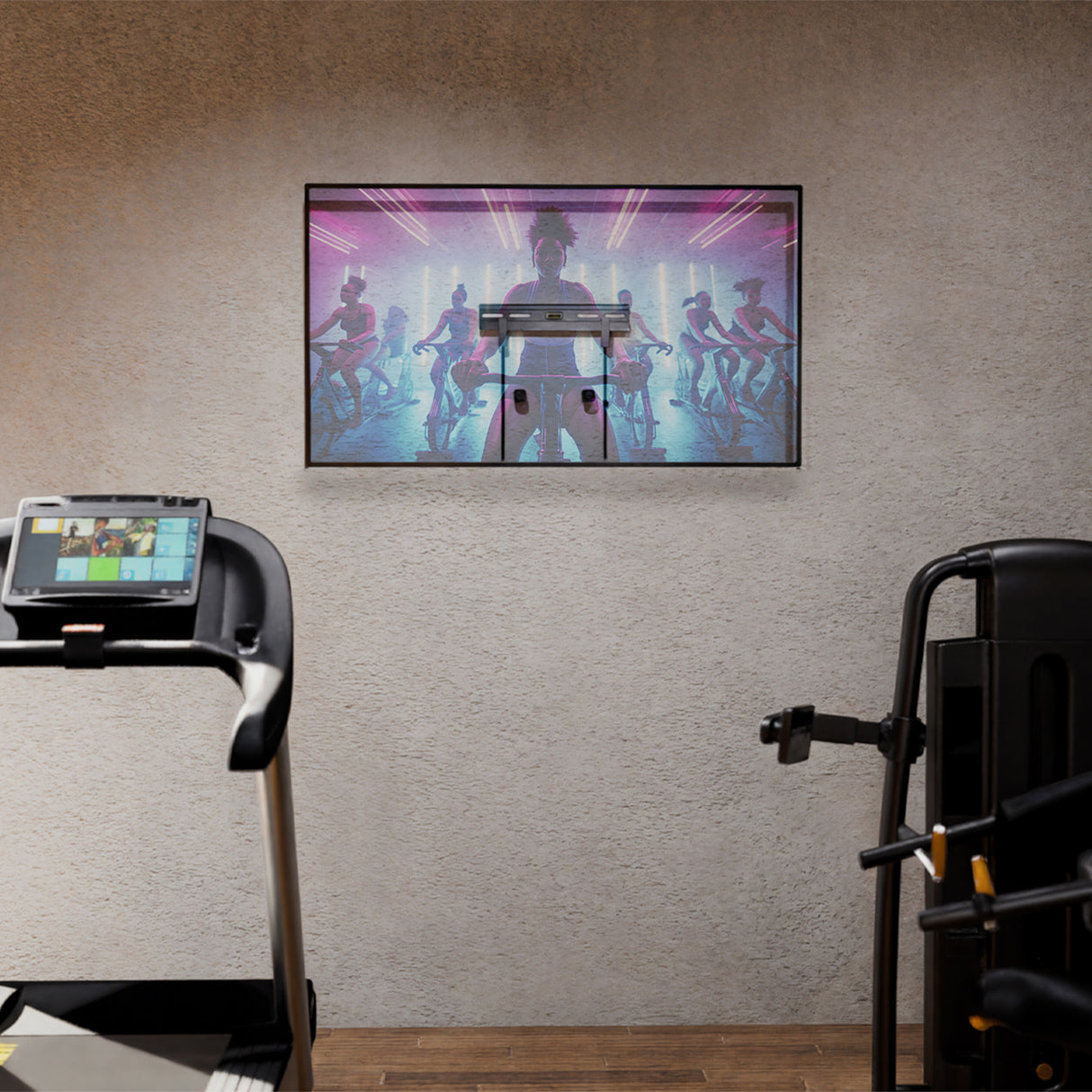 No Stud TV Wall Mount for TVs 23" - 65" No Stud TV Wall Mount for TVs 23" - 65" installed on a textured wall in a home gym setting, holding a flat screen TV streaming a fitness class, showcasing its low-profile design, clean mounting without visible studs or damage, and suitability for spaces like bedrooms, apartments, or offices where easy, damage-free installation is key.