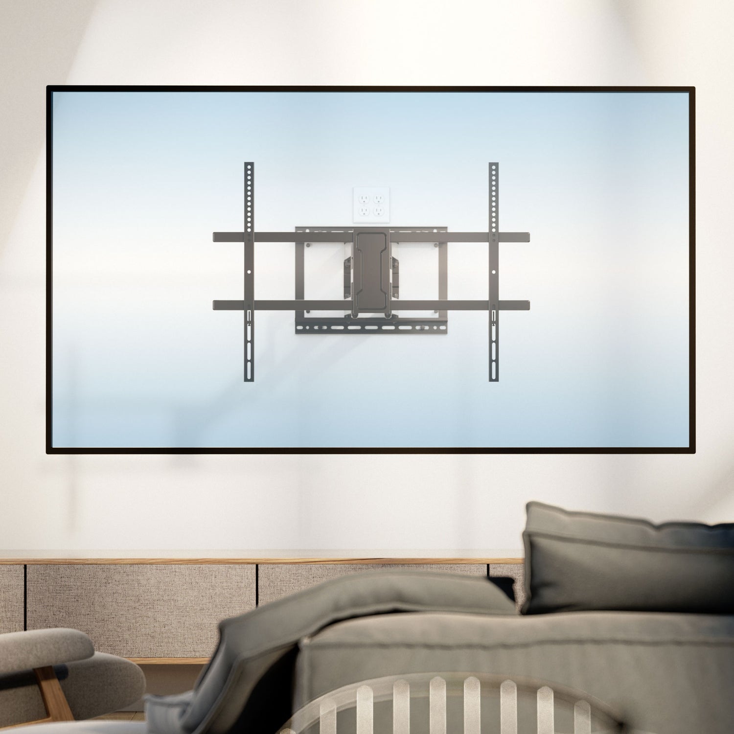 Full Motion TV Wall Mount with Extra Long Extension for 43" - 100" TVs installed on a light-colored wall behind a modern living room setup, showcasing its heavy-duty steel construction and adjustable arms designed for swivel, tilt, and up to 42.5" extension, supporting medium to extra-large TVs with a sleek, space-saving retractable design.