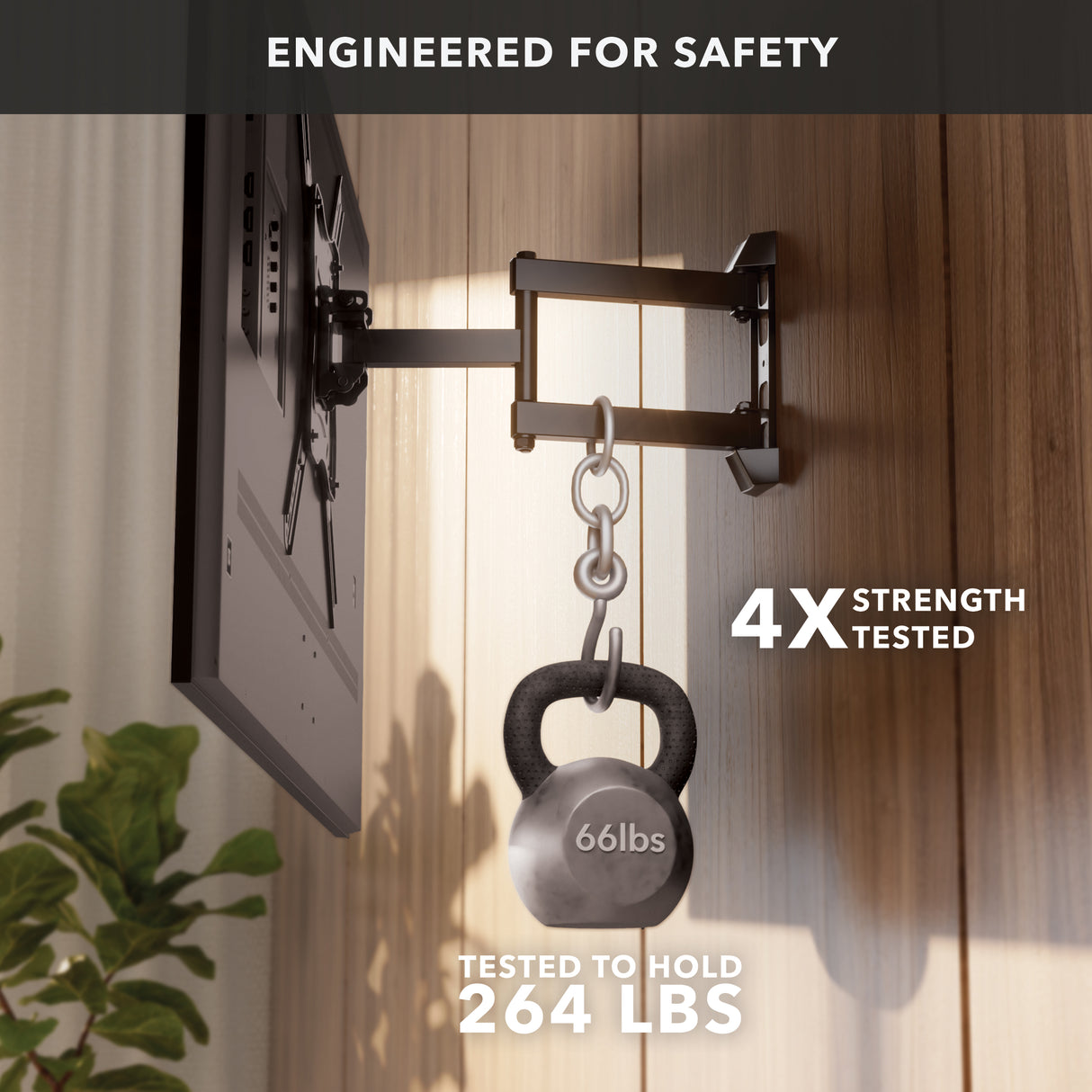 The Mount-It! Full Motion TV Wall Mount supports a TV and a 66-pound kettlebell, proving its strength. Text: Engineered for safety, 4X strength tested, tested to hold 264 lbs. A plant is placed near a wooden wall.