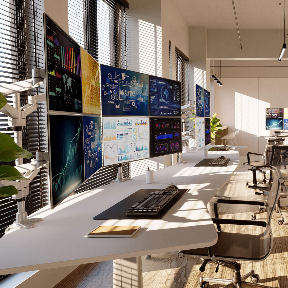 Modern office workspace featuring the Full Motion Quad Monitor Desk Mount holding four large screens displaying various colorful data charts and analytics with swivel and tilt adjustments, mounted on a sleek white desk with ergonomic chairs, abundant natural light through large windows, showcasing a clean, productive environment optimized for multitasking and comfort.