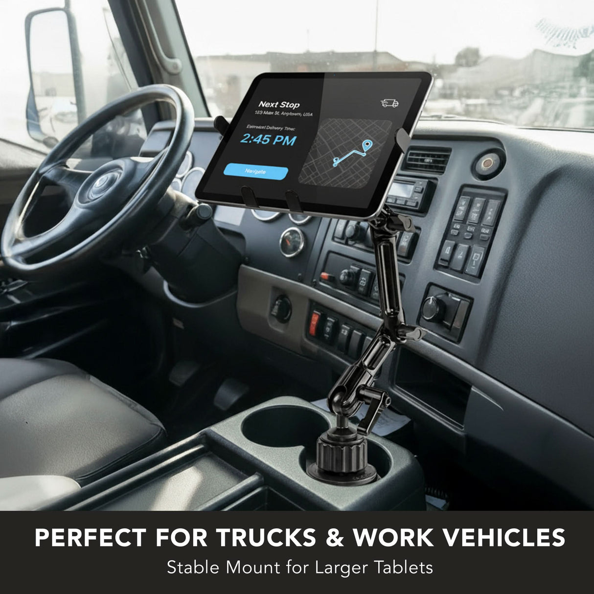 The Mount-It! Heavy-Duty Cup Holder Tablet ELD Mount is installed in a truck cab’s console, displaying navigation. Perfect for trucks and work vehicles, this stable mount securely holds larger tablets.