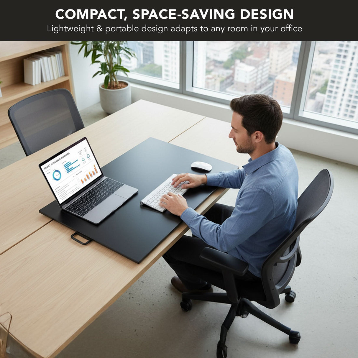 A man uses a Mount-It! Height Adjustable X-Lift Standing Desk Converter with his laptop and keyboard in a modern office. Text above reads, "Compact, space-saving ergonomic desk converter adapts to any workspace.