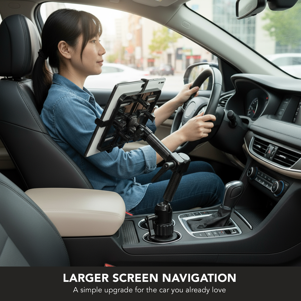 A woman sits in the driver’s seat using the Mount-It! Carbon Fiber Cup Holder Tablet ELD Mount for navigation. The text reads: Larger Screen Navigation—an easy upgrade for the car you already love.