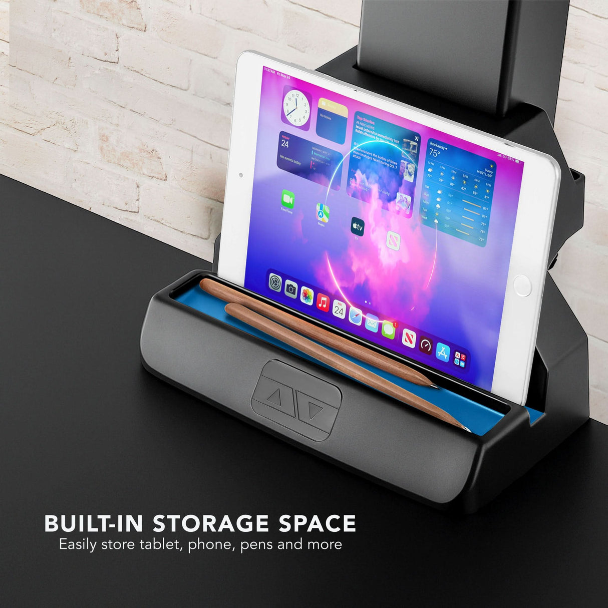 Tablet stand with built-in storage space on a standing desk converter