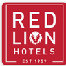 A square logo with a red background featuring the words "RED LION HOTELS" in white capital letters, with a stylized white lion head graphic positioned between the words "RED" and "LION," and the text "EST 1959" centered below the word "HOTELS. A square logo with a red background featuring the words "RED LION HOTELS" in white capital letters, with a stylized white lion head graphic positioned between the words "RED" and "LION," and the text "EST 1959" centered below the word "HOTELS.