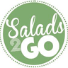 A circular logo featuring the text "Salads 2 Go" in a combination of cursive and bold block letters, set against a solid green background with a dotted circular border around the edge. A circular logo featuring the text "Salads 2 Go" in a combination of cursive and bold block letters, set against a solid green background with a dotted circular border around the edge.