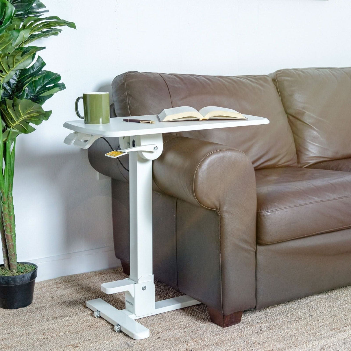 Mobile Standing Desk - Foldable Rolling Overbed Table - MI-8046 - next to a couch with book and coffee cup
