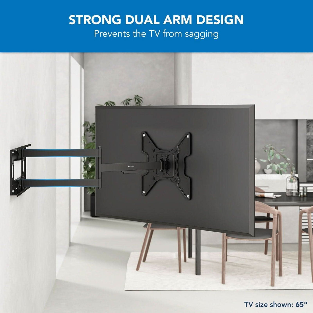 In a modern living room, a 65-inch TV is mounted on the wall with the Mount-It! Full Motion TV Wall Mount with Extra Long Extension. Text reads: Strong Dual Arm Design prevents sagging—ideal for larger TVs and extra long wall mounting.