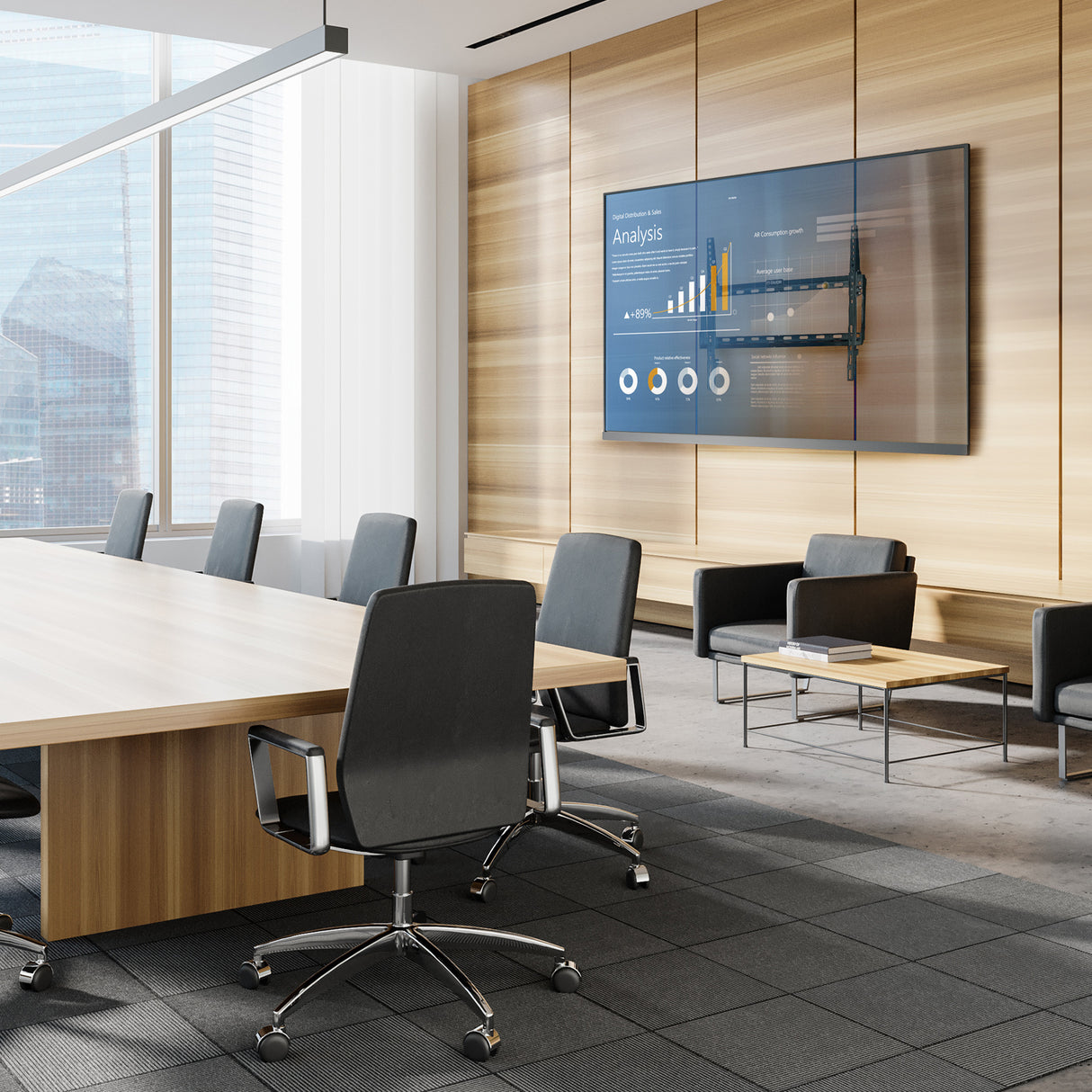 Wall-mounted TV display with data analytics screen in a modern conference room featuring wood panel walls, rolling office chairs, and natural light.