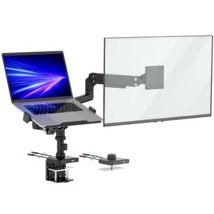 The Mount-It! Heavy-Duty Monitor and Laptop Mount with Pole and Gas Spring Arms holds a laptop (left, displaying blue light streaks) and a large flat screen (right, blank), both on adjustable arms with a desk clamp.