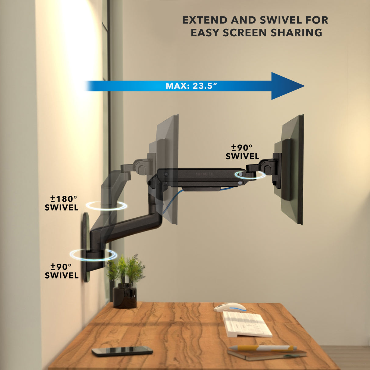 Heavy-Duty Monitor Wall Mount with Gas Spring Arm shown installed on a wall above a desk, illustrating its maximum 23.5-inch extension and multiple swivel angles including 180 degrees at the base and 90 degrees near the monitor for flexible screen positioning and easy sharing, featuring a clean workspace with minimal clutter.