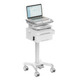 The Mount-It! MedHub Compact Mobile Workstation with Drawers is a white cart with locking casters, modern design, pull-out shelf, storage drawer, and keypad lock—ideal for secure healthcare use and easy mobile documentation.