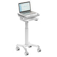 The Mount-It! MedHub Motorized Mobile Workstation is a white medical cart with locking casters, a secure technology enclosure, an adjustable tray underneath, and a laptop on top displaying data charts.
