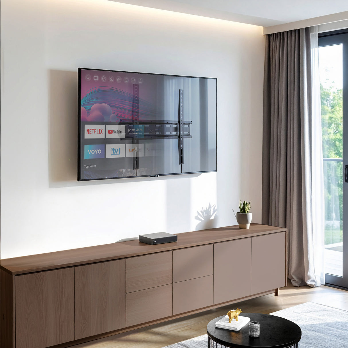 Modern living room with a flat-panel TV mounted close to the wall using the Mount-It! Low Profile Slim TV Wall Mount Fixed TV Bracket, showcasing its sleek design that holds the TV just 1.1 inches from the wall for a clean, space-saving appearance, compatible with 32 to 55-inch TVs and providing sturdy, durable support with a minimalist look.