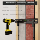 No Stud TV Wall Mount for TVs 23" - 65" displayed with a black mounting bracket attached to a wall showing options for wood studs, concrete walls, and brick walls, alongside a yellow and black cordless drill highlighting easy installation with hardware included and built-in bubble level for precise mounting.