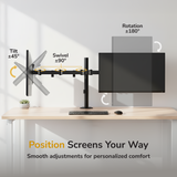 The Mount-It! Full Motion Dual Monitor Desk Mount holds two screens with ergonomic tilt (±45°), swivel (±90°), and rotation (±180°) adjustments. A clean setup with keyboard and mouse. Text: "Position Screens Your Way.