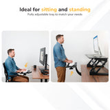 A man uses the Mount-It! Standing Keyboard and Mouse Platform With Ergonomic Wrist Rest Pad at his desk, first sitting and then standing. Text above reads, Ideal for sitting or standing. Fully adjustable tray to fit your needs.