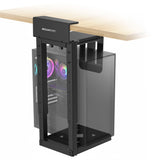 The Mount-It! Heavy-Duty Clamp-On CPU Mount is attached under a wooden desk, securely holding a desktop PC with visible RGB lighting.