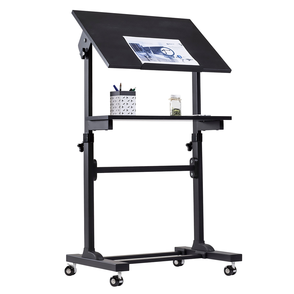 The Mount-It! Mobile Lectern Stand Up Desk is a black, height-adjustable drafting table on wheels with a tilted work surface for papers, a flat shelf with pencil holder and jar, suitable as a podium or desk, shown on a white background.