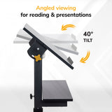 Side view of the Mount-It! Mobile Lectern Stand Up Desk with a tilting surface up to 40°, arrows show tilt range. Text: Angled viewing for reading & presentations, ideal for a versatile sit-stand workstation.