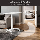 The Mount-It! Sit-Stand Mobile Laptop Cart is shown beside a gray couch, with an arrow highlighting its easy mobility to any room; text reads: Lightweight & Portable for Every Room in the House.