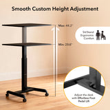 The Mount-It! Height Adjustable Rolling Laptop Desk features a black frame on wheels, adjusts from 29.6" to 44.2", and includes a foot pedal lift for effortless ergonomic comfort throughout your workday.