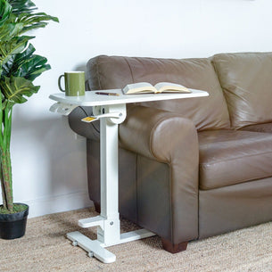 Mobile Standing Desk - Foldable Rolling Overbed Table - MI-8046 - next to a couch with book and coffee cup