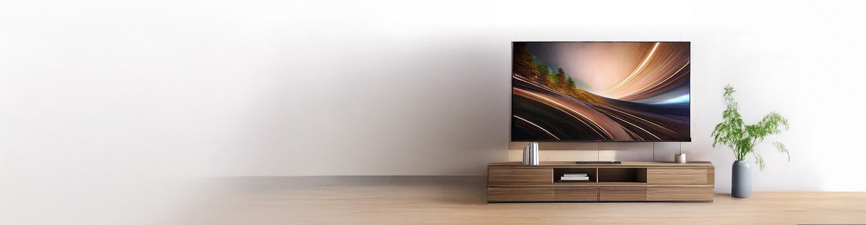 A modern living room setup featuring a sleek flat-screen television placed on a low-profile wooden TV stand with open shelving. The stand holds electronic devices and accessories, while a tall green plant in a pot is positioned to the right, adding a touch of nature. The background has a clean, minimalistic white wall with soft lighting that creates a calm and organized atmosphere.